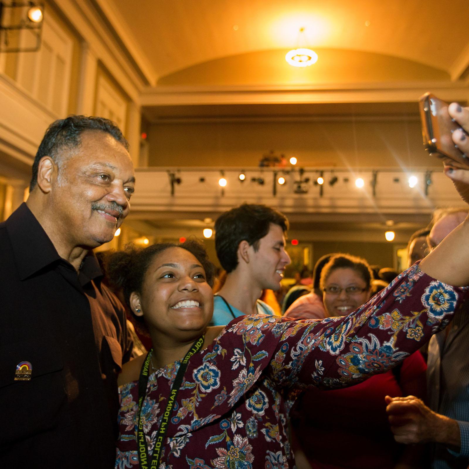 Young Randolph College student takes a selfie with civil rights leader Rev. Jesse Jackson